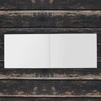 Blank white paper on wooden table photo