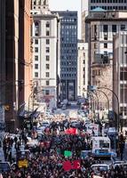 MONTREAL, CANADA APRIL 02 2015 - People walking in the middle of the street. photo