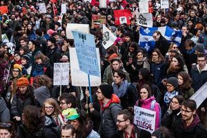 MONTREAL, CANADA APRIL 02 2015 - Protesters Holding all kind of Signs, Flags and Placards in the Streets. photo