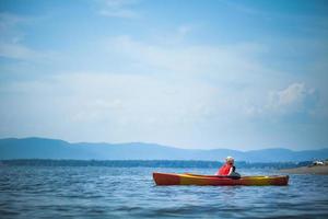 Woman Relaxing on a Kayak and Enjoying her Life photo