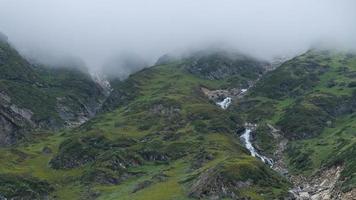 Lush Greenery Covered Mountainside of Himalayas and Springs of Glacial Water. photo