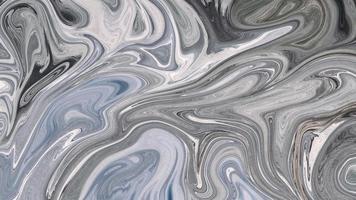 Colorido remolino gris abstracto textura espiral de lujo y pintura patrón acrílico líquido en negro. foto
