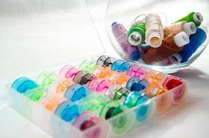 Bobbins with thread photo