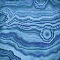 abstract blue agate marble texture decoration with aqua tone fluid marbling effect on dark blue. photo