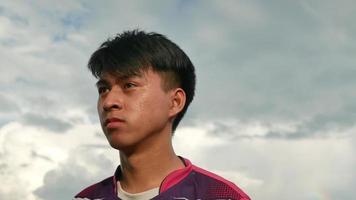 Portrait of tired teenage boys jogger resting after long run standing outdoors and looking away. video