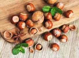 Hazelnuts on a old wooden table photo