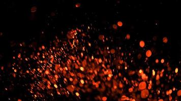 light orang glitter magic sparkling stars powder splash vintage on black photo