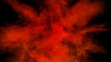 light red colorful powder explosion colored cloud dust explode on black photo