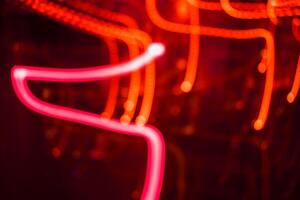 light orange and pink light trail blur abstract lights at motion exposure time swirl trail effect photo