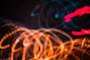 orange and blue light trail blur abstract lights at motion exposure time swirl trail effect photo