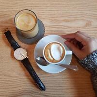 milk coffee with ice cream in a cup on the table photo