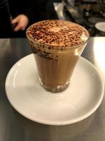 Chocolate milk coffee with chocolate powder in a glass photo