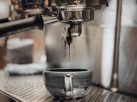 machine makes steel coffee with motion blur photo