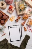 top view writing new year goals, resolution or shopping list on a blank paper. Mock up design photo