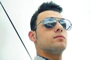 Attractive man with tinted sunglasses photo