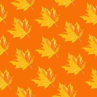 Seamless pattern of autumn maple leaves on an orange background vector