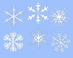 set of Christmas snowflakes on a blue background vector