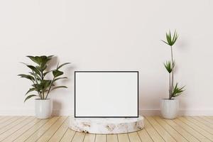 Maqueta de marco de fotos horizontal negro en un podio de mármol en una habitación vacía con plantas en un piso de madera