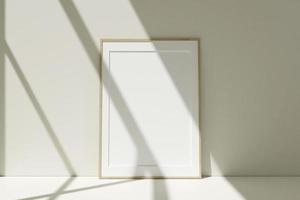 Vertical wooden photo frames mockup on the floor leaning against the room wall with shadow