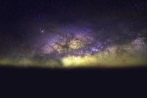 light yellow dramatic galaxy night panorama from the moon universe space on night sky photo