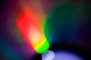 rainbow blur multicolored sparkle bright abstract colorful on black photo