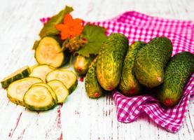 green cucumber fruit pattern natural fruit with clipping path on wood. photo