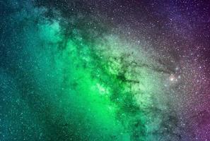 background of abstract galaxies with stars and planets with green galaxy motifs of the night light space universe