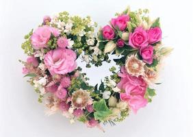 light pink and purple beautiful love flower roses and red hearts and fresh lilac flowers on white photo