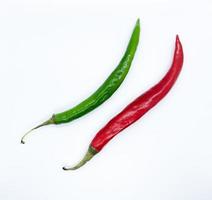 red and green chili pepper isolated on white background. a tiny ingredient can give a super spicy taste to dishes. photo