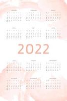 Plantilla de calendario 2022 sobre fondo rosa coral dibujado a mano con pinceladas de acuarela. diseño de calendario para impresión y digital. la semana comienza el domingo vector