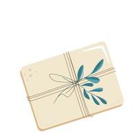 A gift in a craft package with green leaves vector