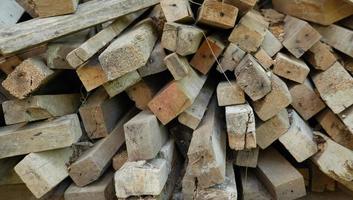 the pile of the construction wood. the chopped wood for construction, and wooden furniture. a versatile lumber for many needs. photo