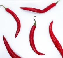 red chili pepper isolated on white background. a tiny ingredient can give a super spicy taste to dishes.