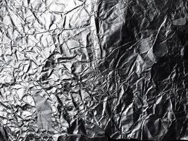 the surface of aluminium foil texture for background and design materials. crumpled texture collection of silver foil. abstract wrinkled pattern background photo