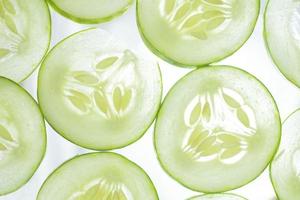 fresh cucumber slices background. collection of fruit and vegetable pattern background. natural green background in full frame. photo