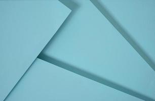 Fondo de papel emergente abstracto en azul. Los arreglos abstractos crean una textura geométrica para papel tapiz, carteles, folletos, etc. foto