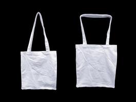 White tote bag isolated black background. Bag to bring shopping items and design mockup templates photo