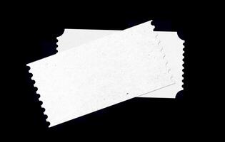 white blank ticket with paper pattern texture for mockup design. isolated ticket form in black background. photo