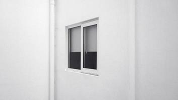 the external facade of the windows of a modern white building. the exterior decoration of the building in an urban area. a simple window frame.