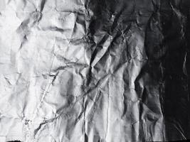 la superficie de la textura de papel de aluminio para materiales de fondo y diseño. colección de textura arrugada de lámina de plata. Fondo de patrón arrugado abstracto foto