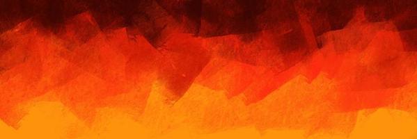 patrón de fondo abstracto cepillado en color naranja con temática de llamas. Elementos de textura pintados de naranja y negro para el diseño creativo.