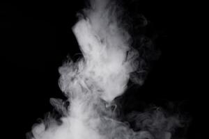 white smoke on black background for overlay effect. a realistic smoke effect for creating an intense nuance in a photo