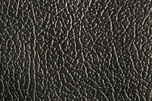 the artificial leather texture in black for a background pattern collection. a detailed element graphic for a creative design. photo