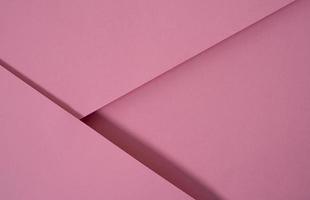 Fondo de papel emergente abstracto en rosa. Los arreglos abstractos crean una textura geométrica para papel tapiz, carteles, folletos, etc. foto