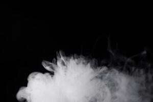 white smoke on black background for overlay effect. a realistic smoke effect for creating an intense nuance in a photo