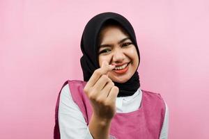 Closeup of beautiful young Muslim woman with korean style love hands, i love you, isolated photo