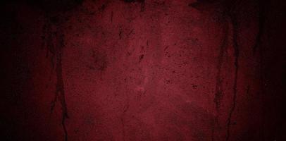 Dark maroon concrete wall for the background. dark red slum cement photo