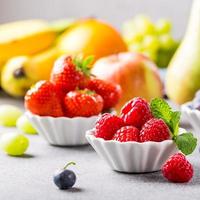 Fresh assorted fruits and berries photo