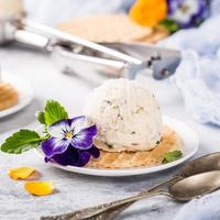 Vanilla ice cream with edible flowers