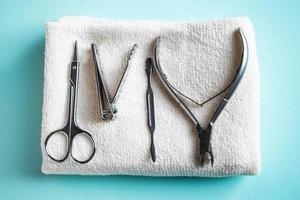 Nail care tools on blue background. photo